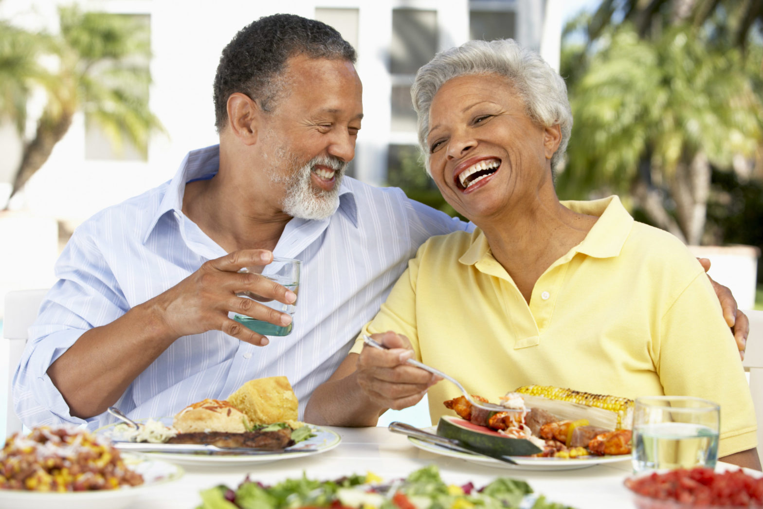 couple eating together laughing