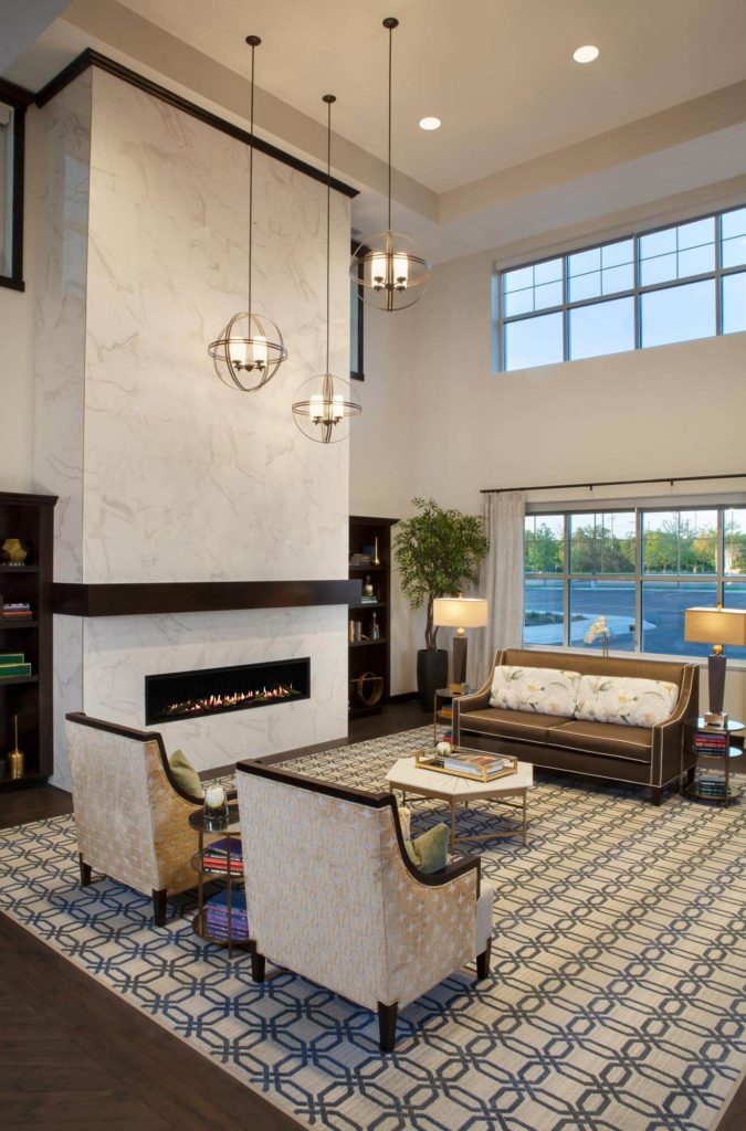 Open Lobby with fireplace and large windows